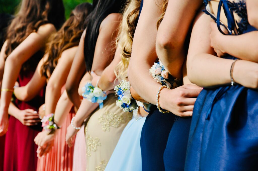 Line of girls taking a photo for prom memories.